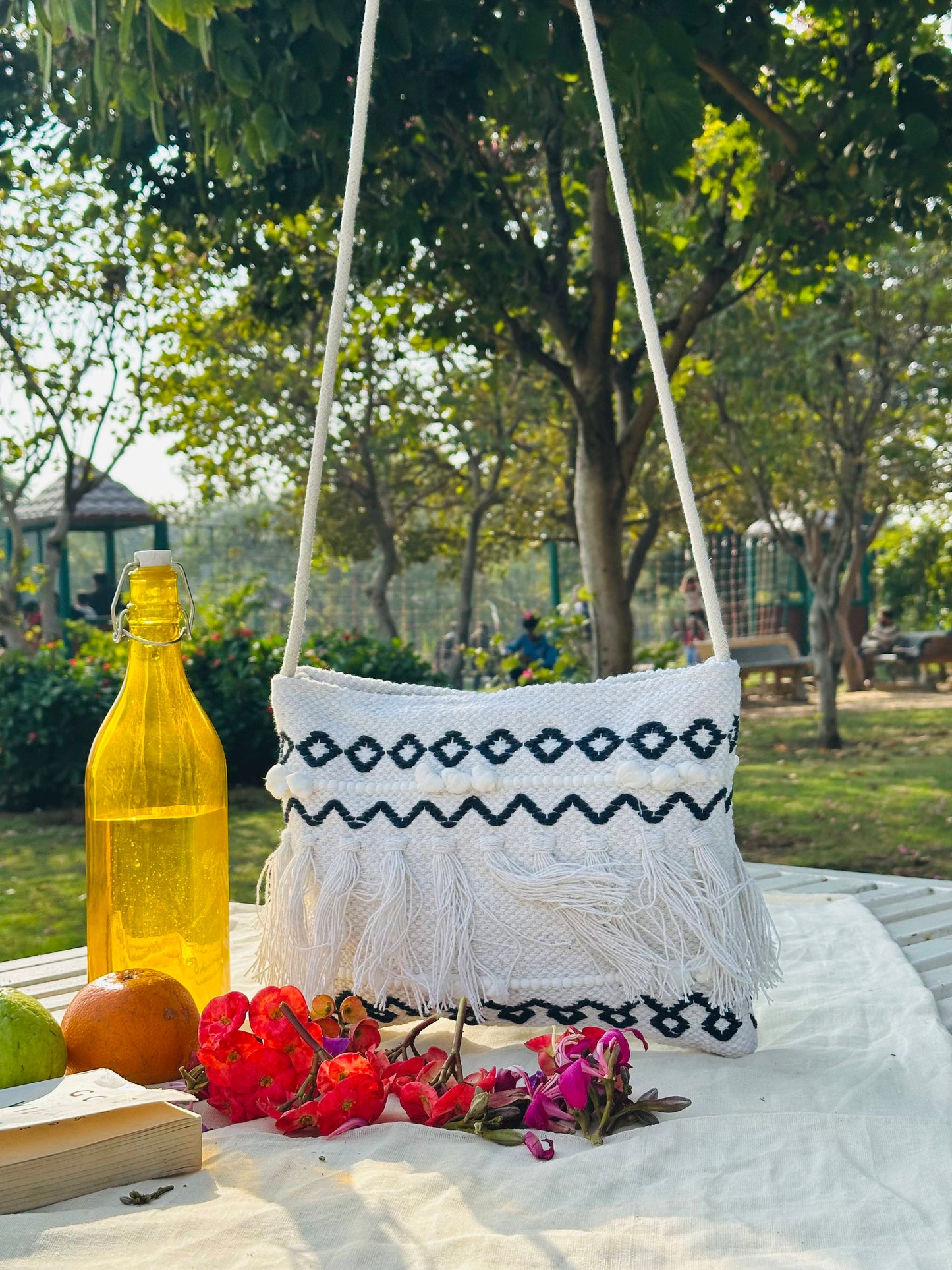 Handwoven Cotton Sling Bag – Ivory & Black Tribal Tassel Design