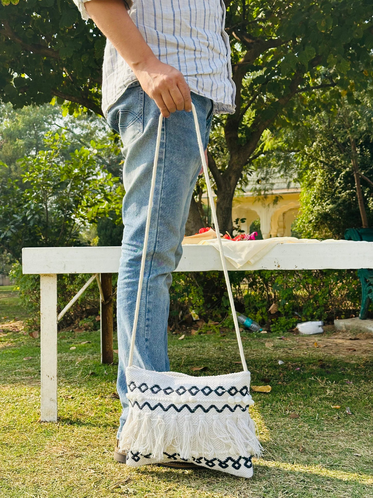 Handwoven Cotton Sling Bag – Ivory & Black Tribal Tassel Design